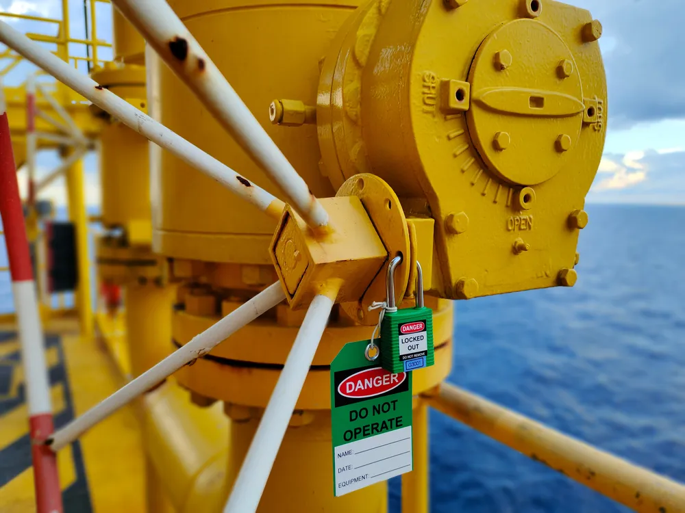 Implement lockout tagout devices